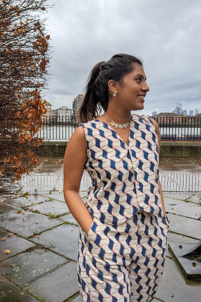 Ilamra hand block printed Kalamkari art organic cotton naturally dyed sharp v-neck and button-down fastening, fitted vest and relaxed pants.